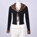 Detail of leopard print faux fur collar and ribbon tie on black ribbed long sleeve top - S / Black