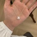 Elegant silver pearl necklace featuring a geometric ring pendant shown on hand - Geometric Ring Artificial Pearl Pendant Necklace (XL1446)