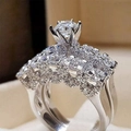 Luxury silver-tone double ring set with round centerpiece and multi-row zircon pavé bands - US 6 / White Gold