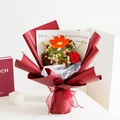 Detail of handcrafted crochet sunflower bouquet with red wrapping and gift cards - Gesang Flower Red Series
