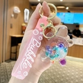 Glow-in-the-dark turtle liquid keychain with pink lanyard and golden clasp - Turtle Bubble Bead - Multicolor