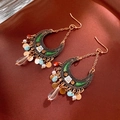 Detail of ethnic crescent earrings with green enamel, amber rhinestones and tassel beads - Ear Hook - Gold