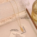 Elegant gold stainless steel necklace with palm and heart pendant and white zircon inlay - Hand of Fatima (N1697-4)