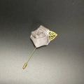 Detail of grey satin rose lapel pin with golden leaf and long metal needle fastener - Silver Gray