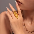 Irregular sculptural gold finish open ring worn by model with high-polish texture - US 7 / Gold