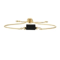 Detail of adjustable gold box chain bracelet featuring a black natural stone pendant - Copper+Lava Stone