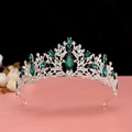 Detailed close-up of baroque bridal crown with emerald green stones and white rhinestones - Silver Green Crystal Crown