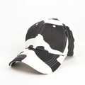 Detail view of cotton baseball cap with black and white cow print and six-panel crown - Adjustable / White Cow
