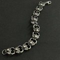 Silver gothic punk bracelet with skull and wing chain links and a lobster clasp closure - No.3 Skull 21cm