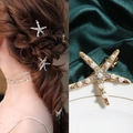Starfish hair clip set in gold metal with pearls and rhinestones on wavy brown hair - Exquisite Rhinestone Pearl Clip