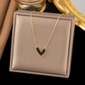 Titanium steel necklace with black heart pendant and gold chain on display - AH214 Black Shell Heart Gold