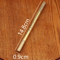 Detailed macro of golden brass bamboo pen showing engraved Chinese characters on wood - Original Color Golden Cudgel Pen