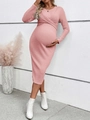 Detail of pink knitted maternity dress featuring a twist knot front and long sleeves - Rose Red