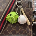 Mini baseball keychain with green glove, bat, and ball hanging on a brown handbag - 3.5CM White Ball Green Set