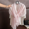 Pink linen blend scarf featuring delicate jacquard patterns and elegant tassels on hanger - Pink