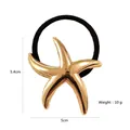 Detail view of golden starfish hair tie with high elastic band and 5cm size markings - Smooth Sea Star / Gold