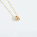 Minimalist gold necklace with a money bag pendant featuring a pink dollar sign charm - Purple