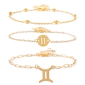 Three-piece golden zodiac bracelet set featuring Gemini symbols and varied chain links - Gemini