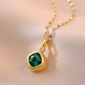 Elegant gold square green gemstone necklace with white diamond accent on pink silk background - Gold Plated Stainless Steel + Zirconia / Emerald