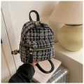 Close-up of black and white plaid tweed mini backpack with premium gold metal zippers - Black