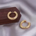 Textured gold-plated chunky hoop earrings with waffle pattern on silk fabric background - Granular Embossed Texture / E-086---Gold