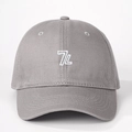 Close-up of gray cotton baseball cap with white 7L embroidery and twill texture details - One Size / Gray