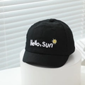 Detailed close-up of the Hello Sun embroidery on this black cotton baby baseball cap - 48-50cm(6 Months-2 Years) / Black