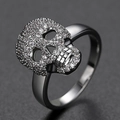 Punk style skull ring in silver finish with pavé set crystals and hollow eye details - US 6 / Silver Clear Zirconia