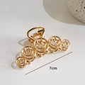 Golden 7cm metal hair claw clip featuring a unique hollowed-out smiley face design - Smiley Face