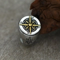 Macro shot of vintage compass ring for men in silver and gold steel with relief details - US 7 / Gold & Silver