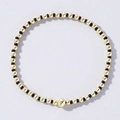Elegant beaded bracelet with alternating gold and black beads and a large gold centerpiece - Black & Gold