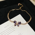 Detailed close-up of golden pull-chain bracelet with purple zircon butterfly pendant - Purple Butterfly Style (Gold)
