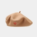 Close-up of wool beret in camel showing detailed red heart embroidery and texture - One Size / Khaki