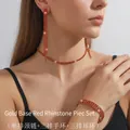 Set coordinato di girocollo, bracciale e orecchini dorati con strass rossi brillanti - Base Oro Strass Rossi Set da 3 Pezzi