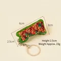 Realistic PVC stuffed green pepper keychain with detailed meat filling, size 6cm x 3cm - Sauce Tiger Skin Stuffed Green Pepper - Keychain Style