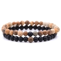Detail view of 6mm couple distance bracelets with matte black and brown stone beads - Picture Jasper