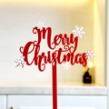 Detail shot of a red acrylic Merry Christmas cake topper with white snowflake patterns - Red and White Double Layer Merry Christmas