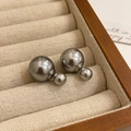 Macro detail of grey double-sided pearl earrings with silver posts in a jewelry box - 4# Steel Needle Grey Double-Sided Pearl Stud Earrings