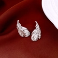 Detailed view of silver feather earrings with zircon inlay on red velvet background - Feather Earrings (S925 Silver Pin) / Silver