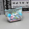 Light blue holographic space travel coin purse with colorful pom-poms and UFO prints - Coin Purse Blue
