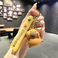 Cute Capybara keychain with yellow silicone wrist strap and golden metal ring - B241-1 Propping Cheeks