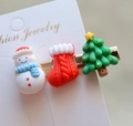Detailed view of Christmas hair clips featuring resin snowman, tree, and sock icons - Style 14 Christmas Hair Clip