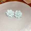 Detailed view of mint green floral earrings with multi-layered petals on a ceramic tray - Light Green Resin Flower Style (64#)