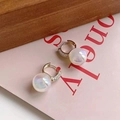 Macro shot of aura pearl hoop earrings with gold plating and cubic zirconia inlay - Gold Pave Zirconia Aura Pearl Hoop Style (A36 Gold)