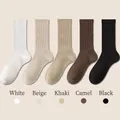 Five pairs of ribbed cotton socks in white, beige, khaki, camel, and black colors - One Size