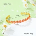 Detail of golden daisy bangle with pink floral motifs and dimensions of 6.5cm diameter - Pink Bracelet