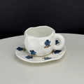 Hand-pinched ceramic coffee cup set with blue floral hand-painted pattern on cream finish - Blue Flower Cup & Saucer