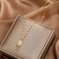 Elegant gold tulip pendant necklace with white opal stone and sparkling zircon detail - Tulip (Lip Chain) / Gold