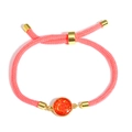 Detail of adjustable pink braided rope bracelet with golden sliding buckle and orange sequin - Red