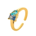 Gold open ring featuring teardrop light blue and rectangular deep blue zircon stones - Open Size 7 / December